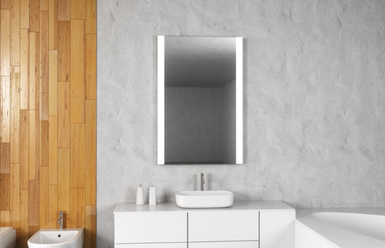 Lustro prostokątne ALA z oświetleniem LED na tle betonowej ściany